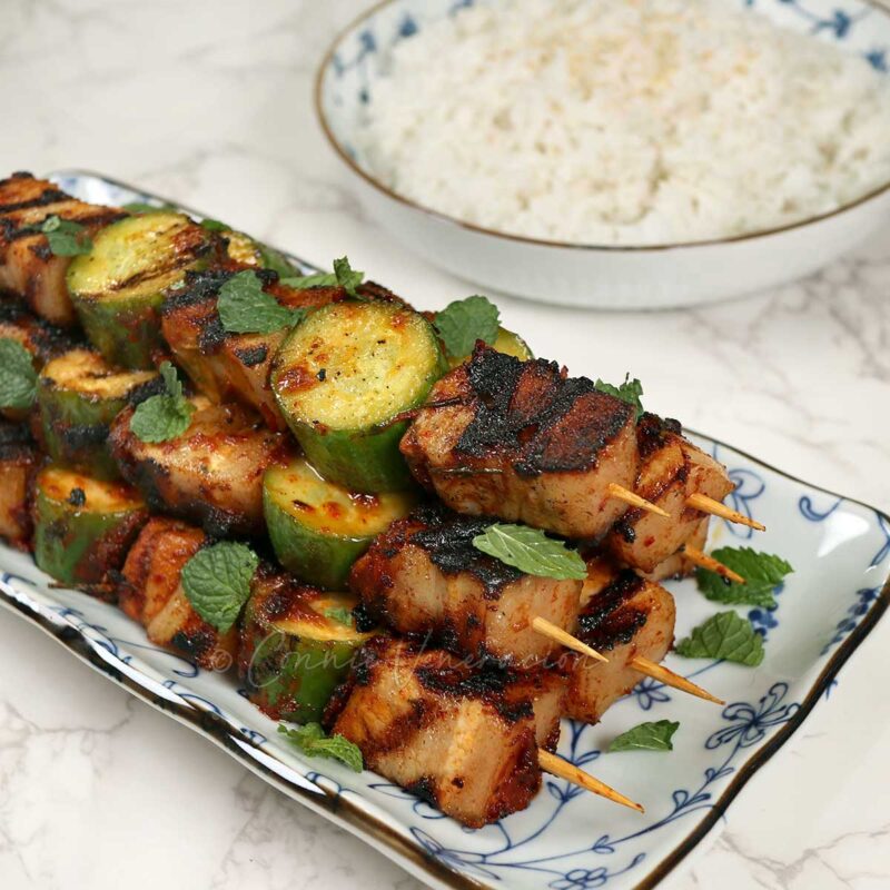 Grilled spicy pork belly skewers
